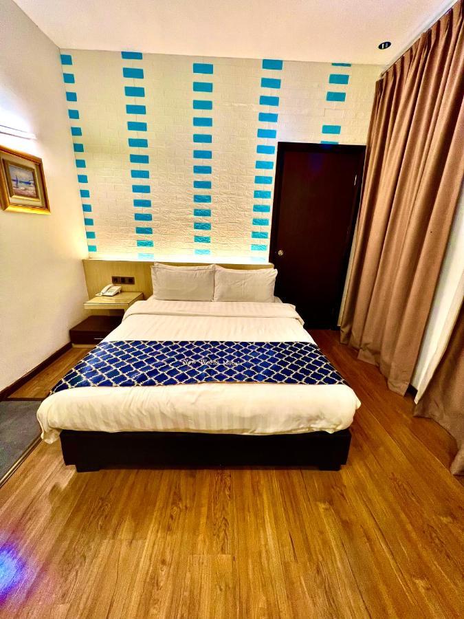 New World Express Motel Бінтулу Екстер'єр фото